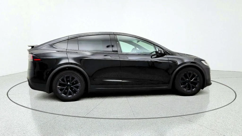 Used 2023 Solid Black Tesla AWD image 4