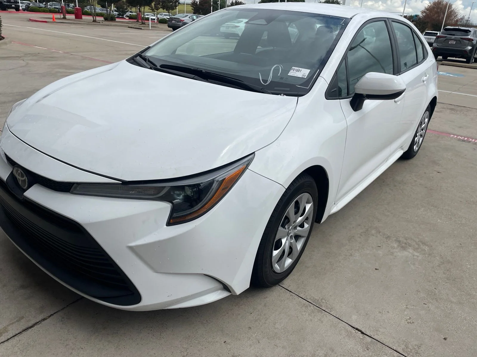 Used 2024 White Toyota LE image 1