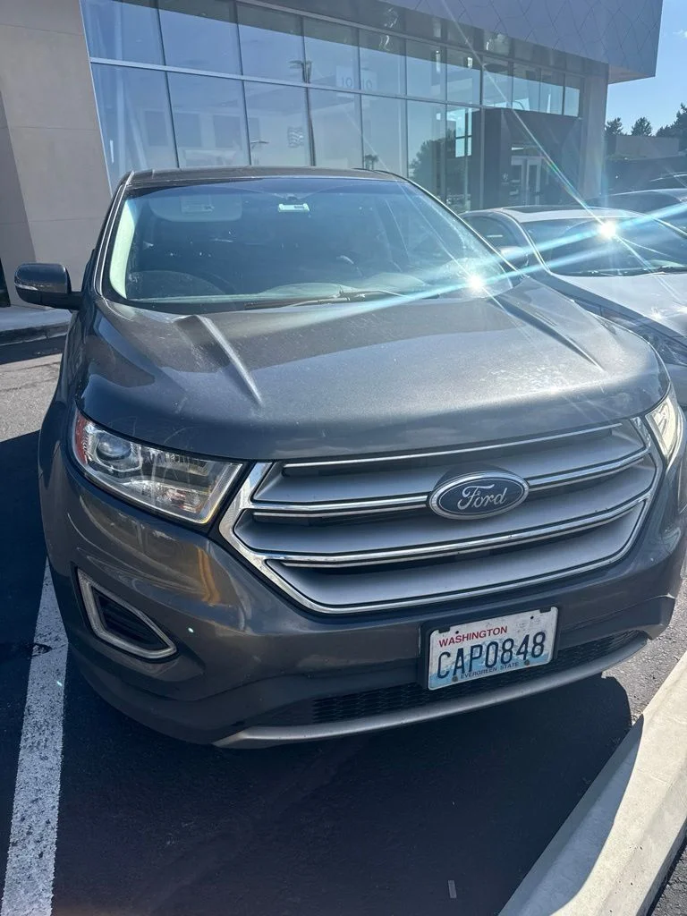 Used 2018 Magnetic Metallic Ford SEL image 1