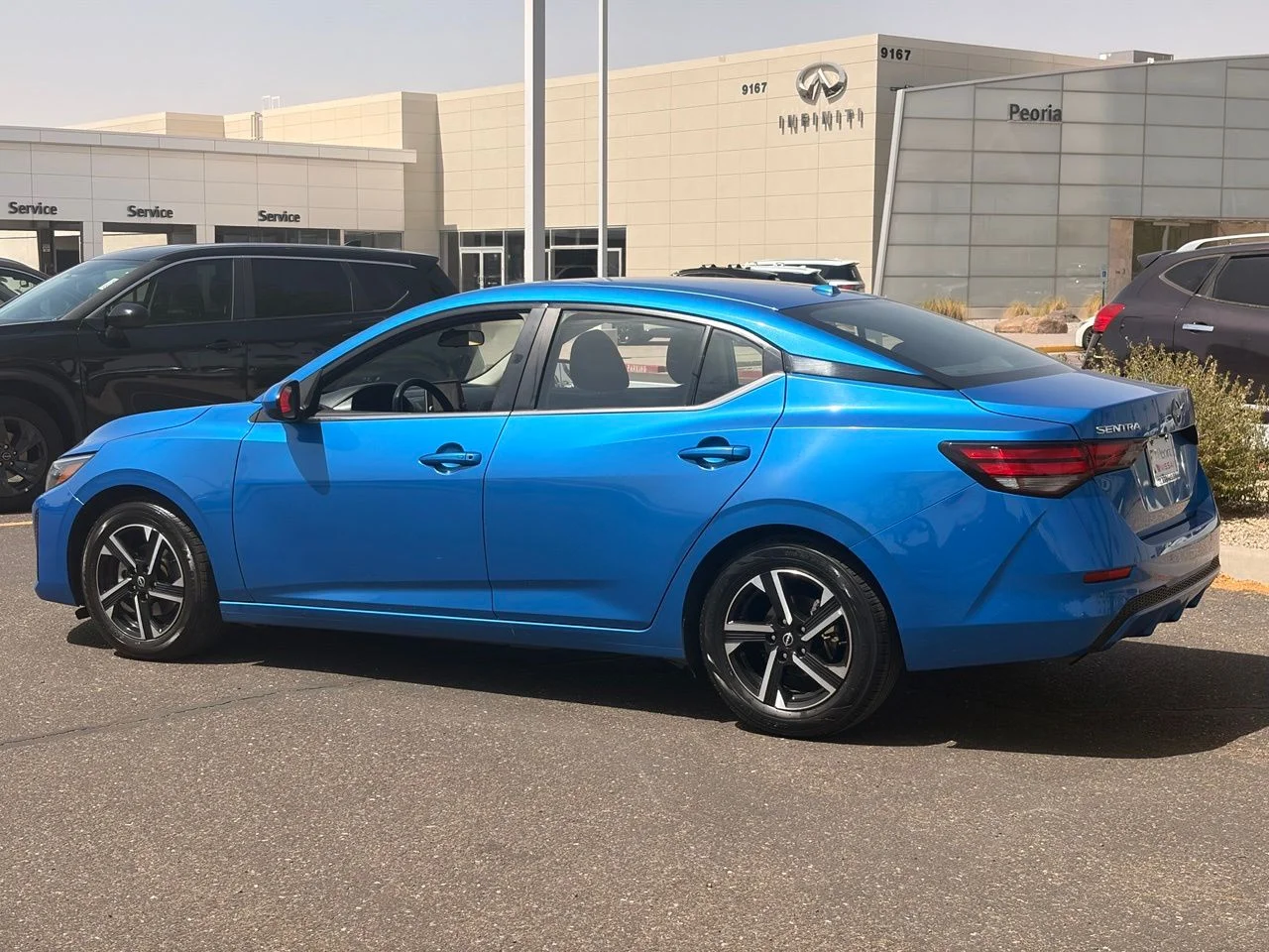 Used 2024 Electric Blue Metallic Nissan SV image 3