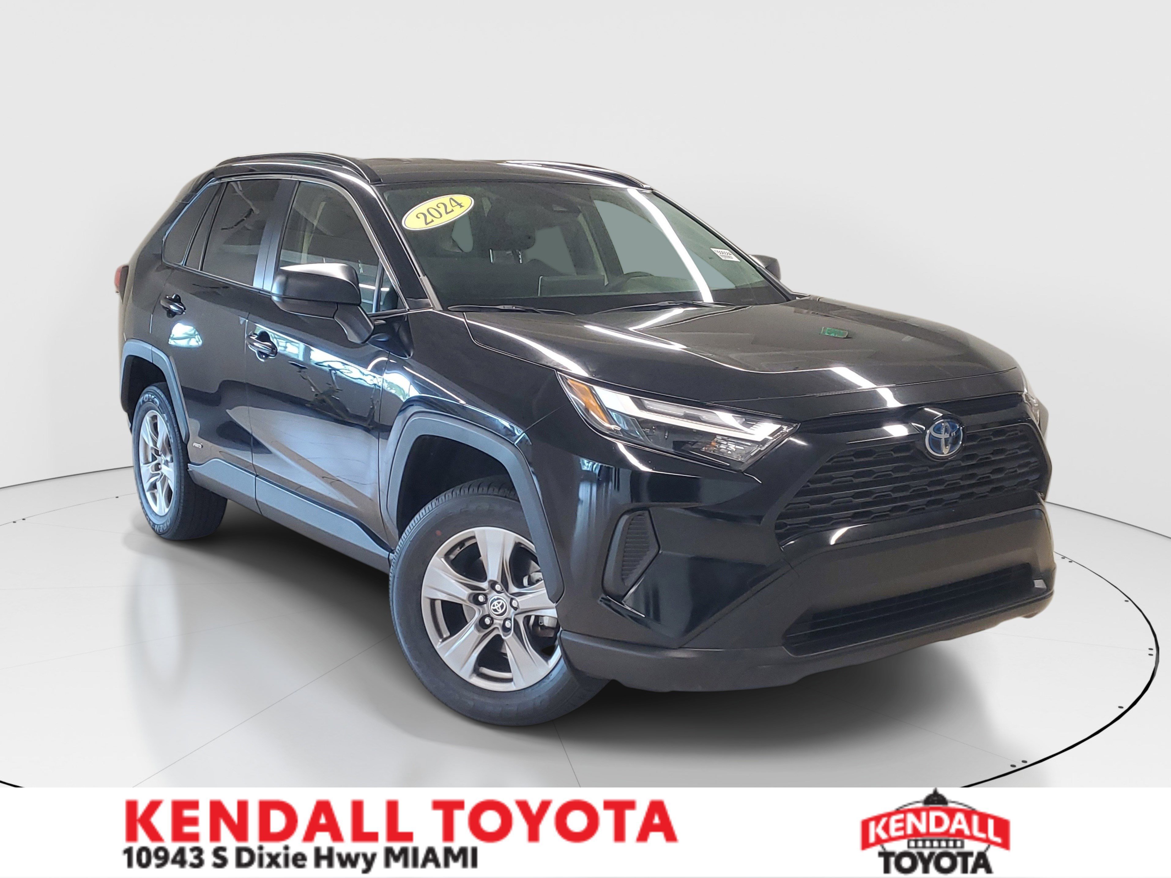 Used 2024 Midnight Black Metallic Toyota Hybrid LE image 1