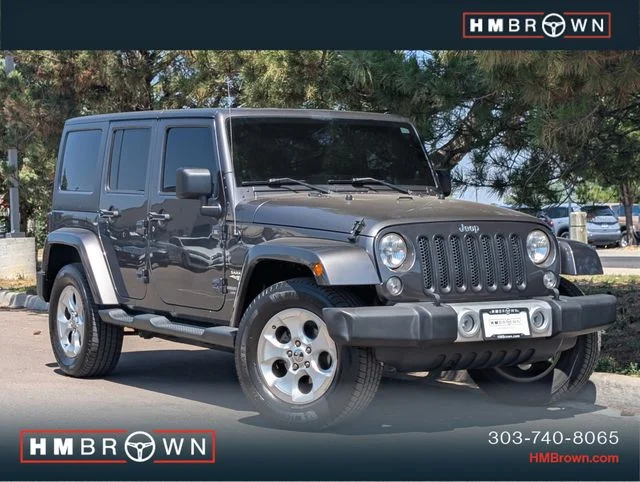 Used 2014 Crystal Metallic Jeep Unlimited Sahara image 1