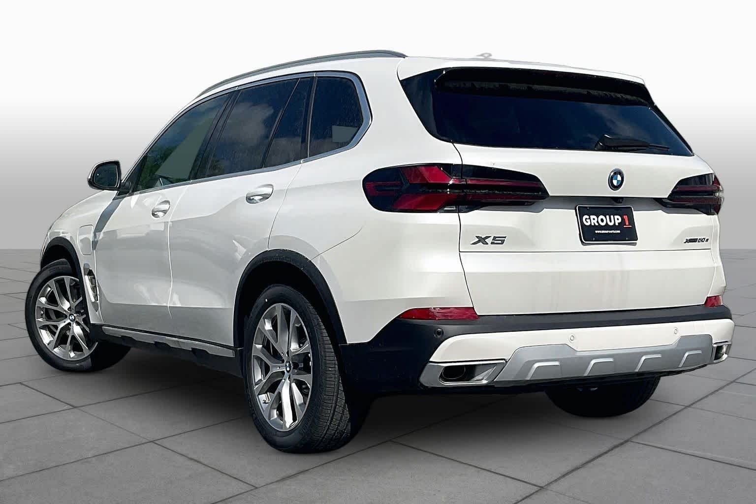 Used 2026 Mineral White Metallic BMW xDrive50e image 12