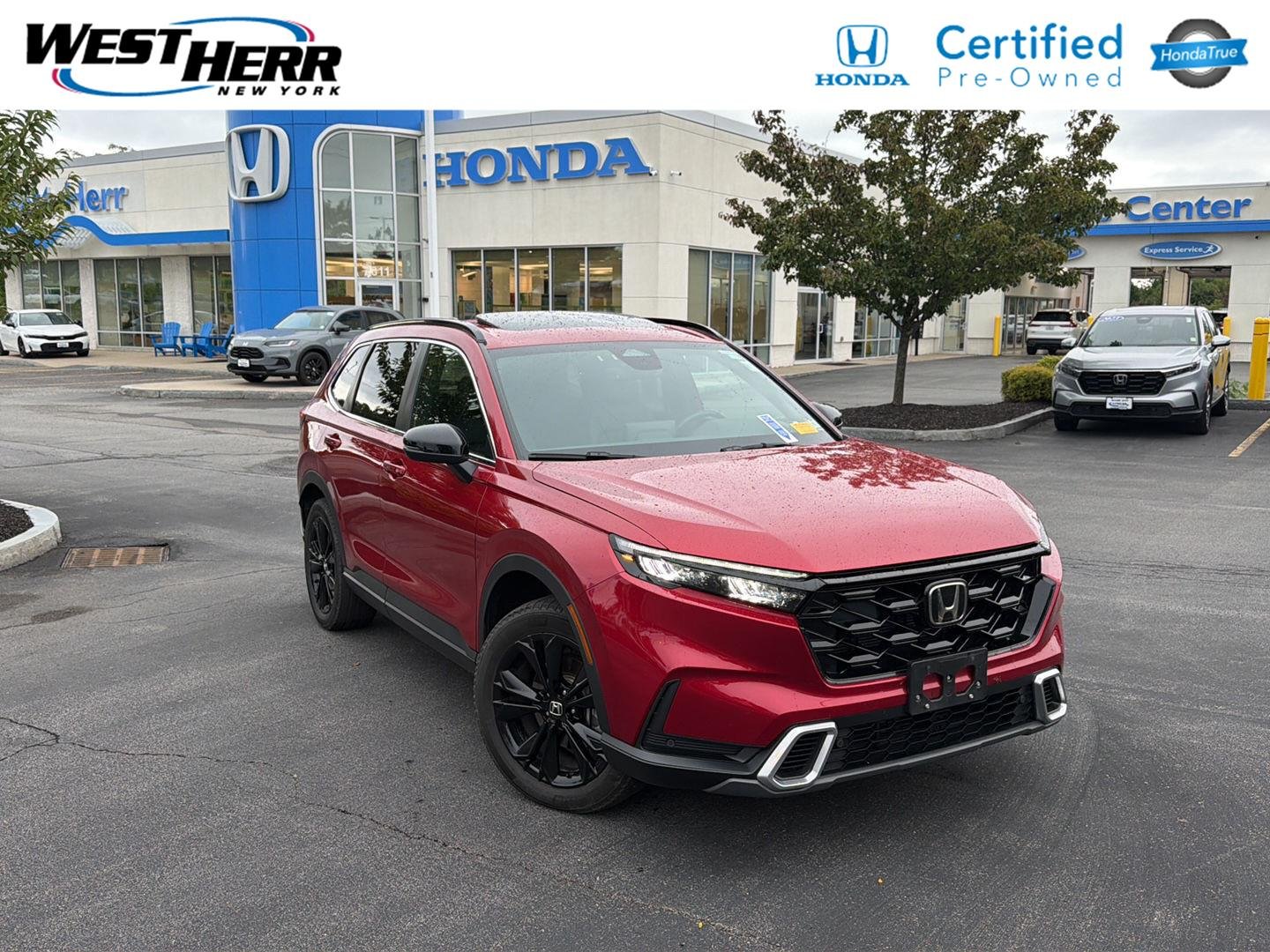 Used 2024 Radiant Red Metallic Honda Sport Touring image 1