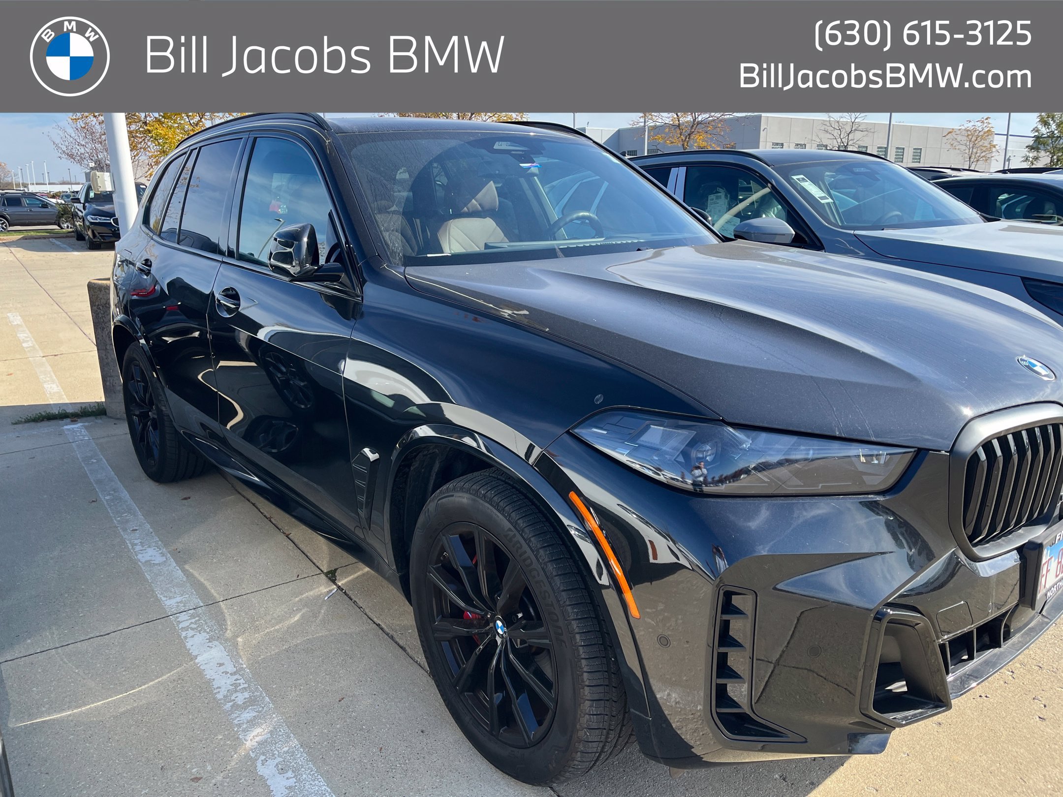 Certified Used 2025 Black Sapphire Metallic BMW xDrive40i image 1