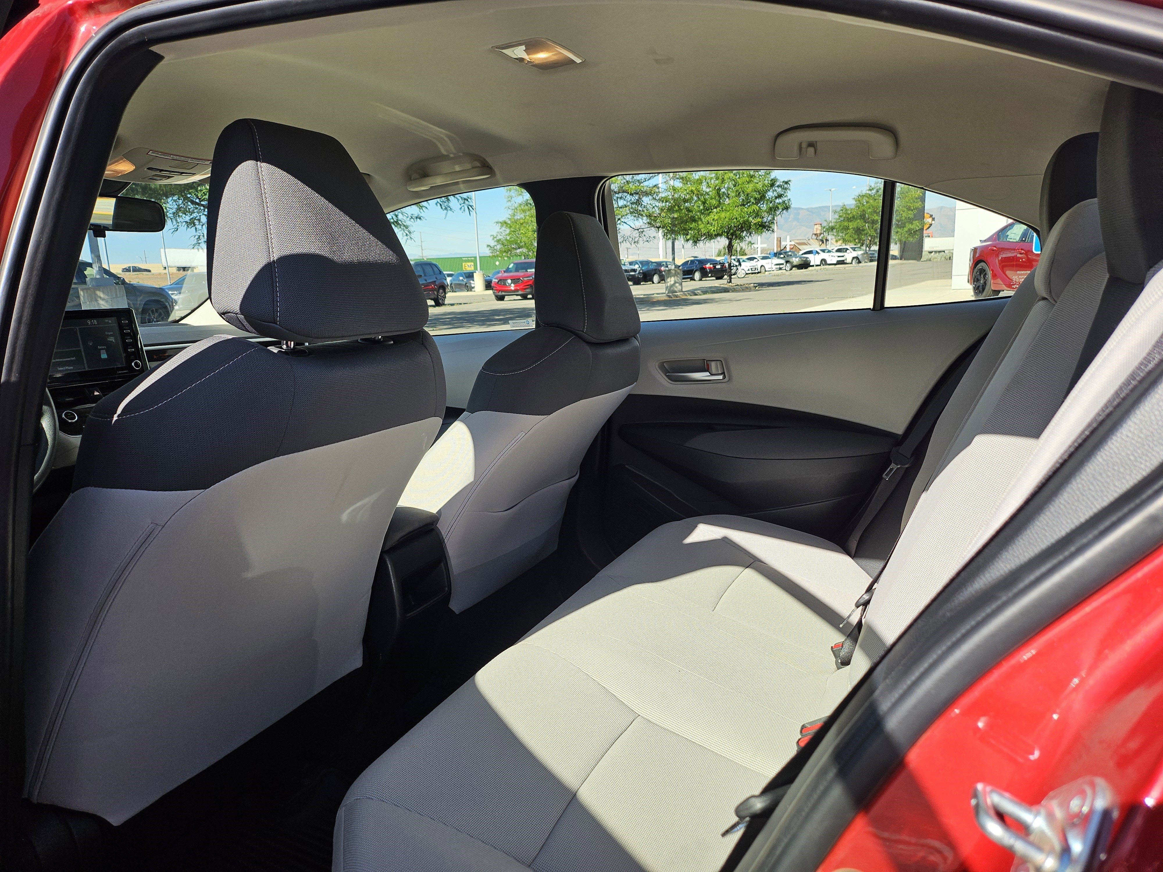 Used 2021 Barcelona Red Metallic Toyota LE image 16