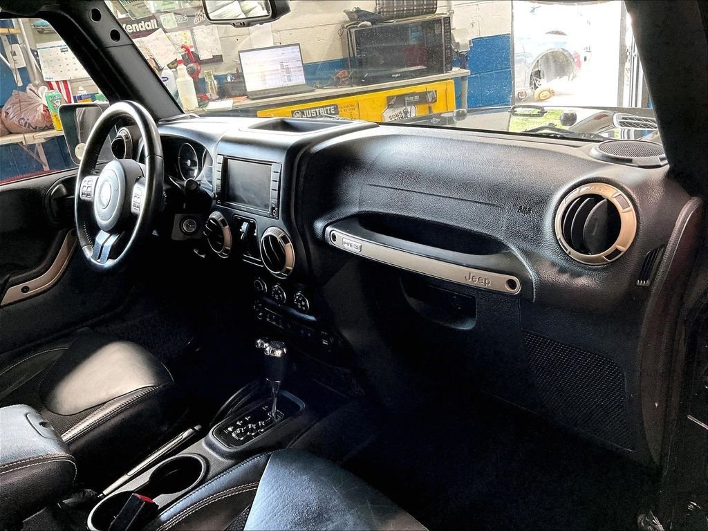 Used 2017 Black Jeep Unlimited Sahara image 14