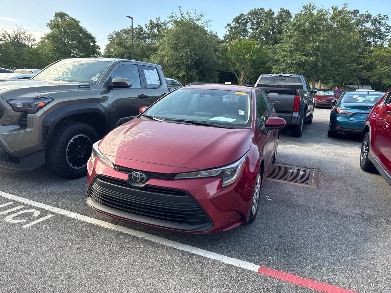 Used 2024 Red Toyota LE image 1