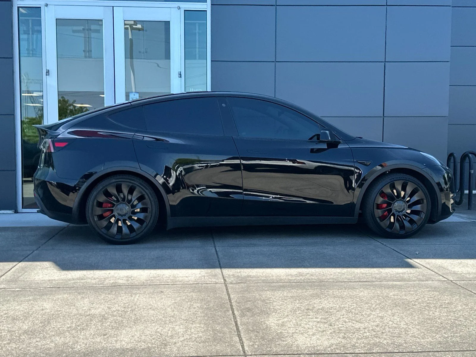 Used 2022 Solid Black Tesla Performance image 2