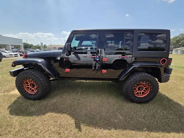 Used 2014 Black Jeep Unlimited Sahara image 6