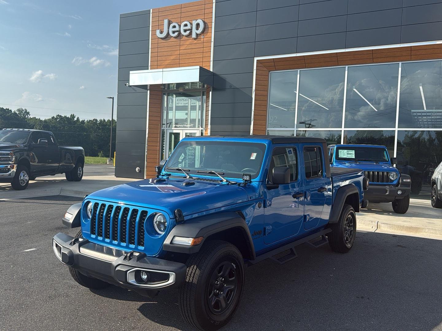 Used 2023 Hydro Blue Pearlcoat Jeep Sport image 1