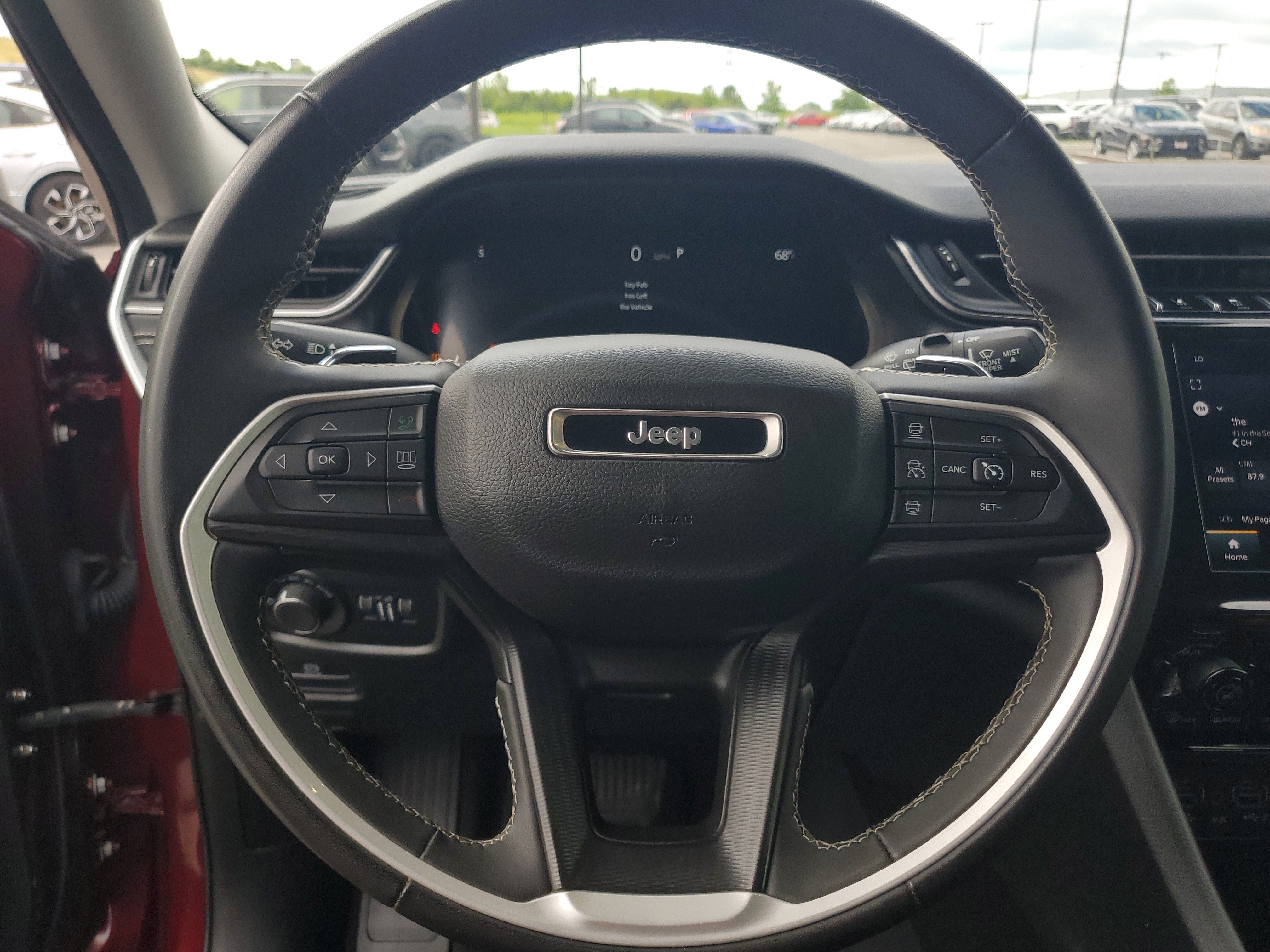Used 2023 Velvet Red Pearlcoat Jeep Laredo image 22