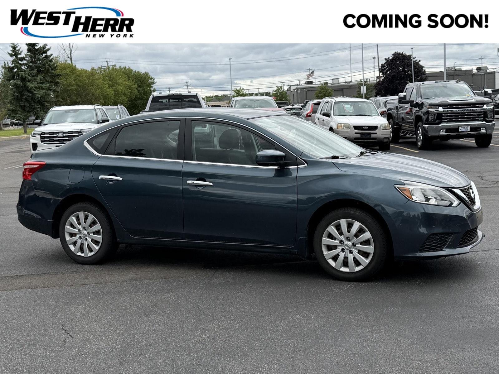 Used 2016 Graphite Blue Metallic Nissan SV image 1