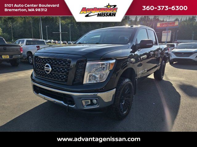 Used 2019 Magnetic Black Metallic Nissan SV image 1