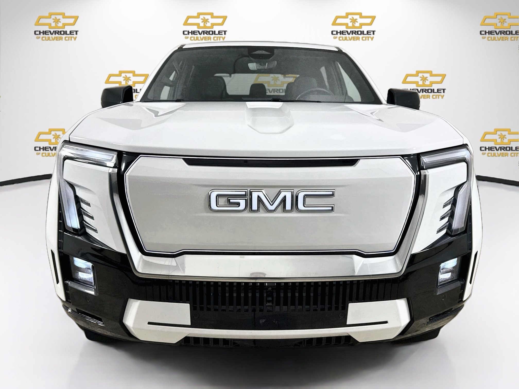 Used 2025 Summit White GMC Max Range Denali image 2