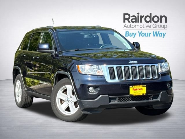 Used 2011 Blackberry Pearlcoat Jeep Laredo image 1
