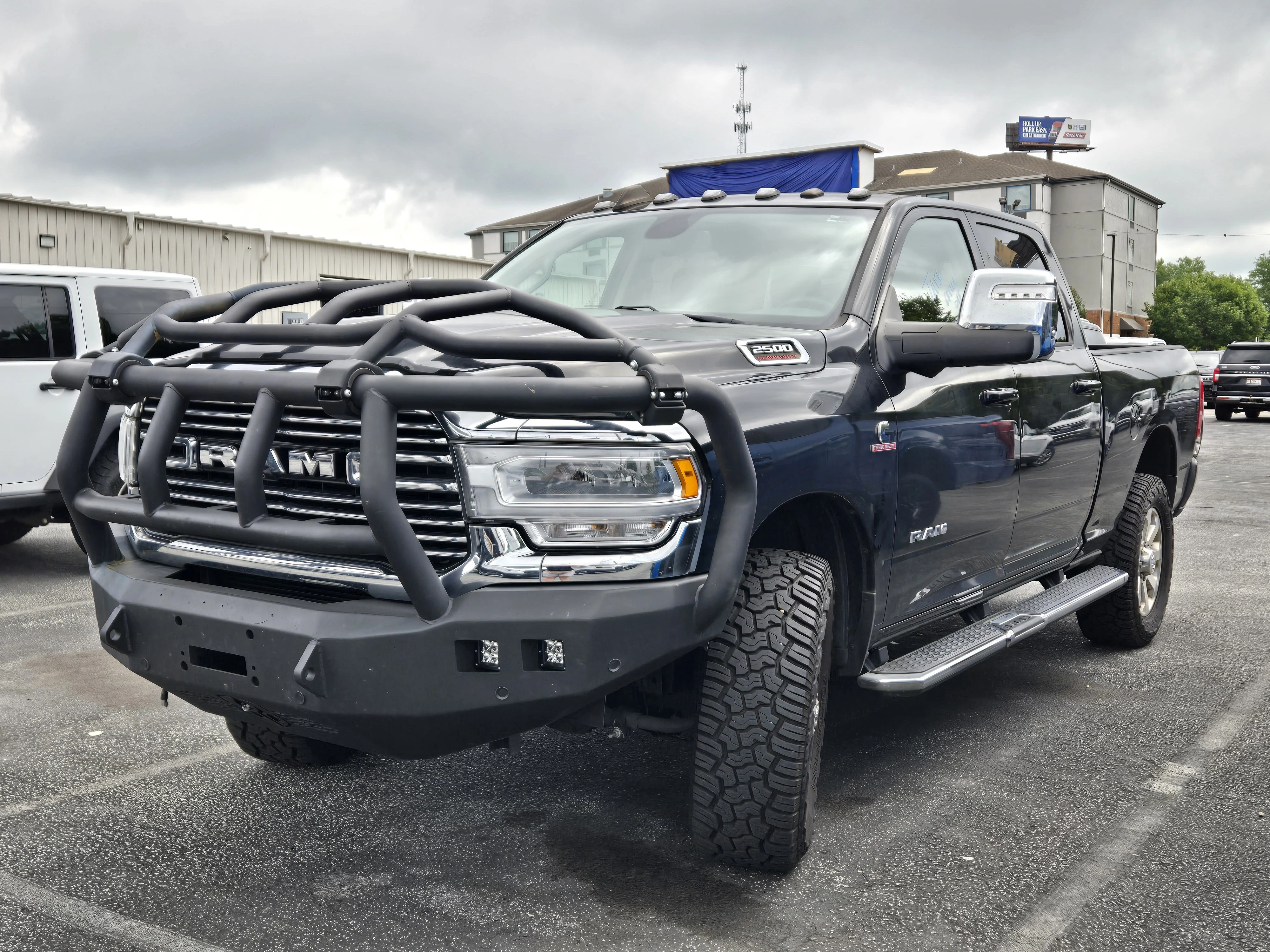Used 2023 Diamond Black Crystal Pearlcoat Ram Laramie image 1