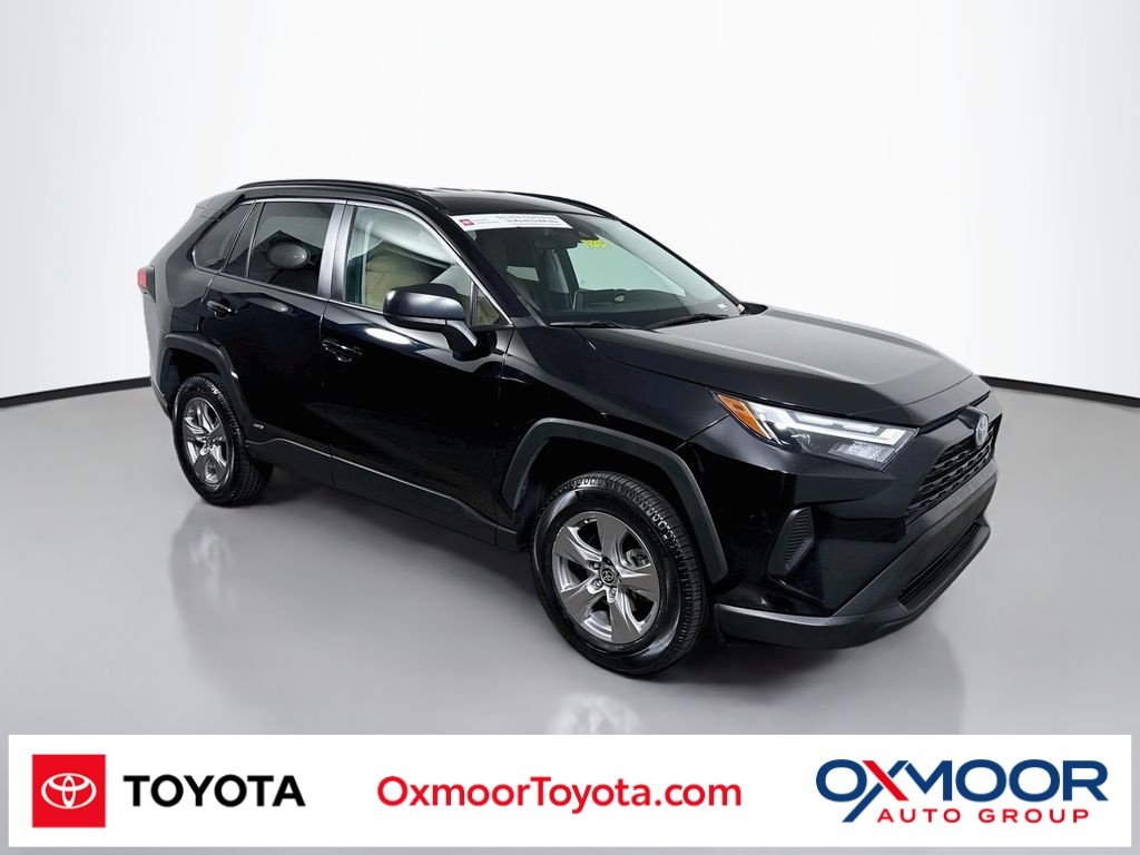 Used 2024 Midnight Black Metallic Toyota Hybrid LE image 1