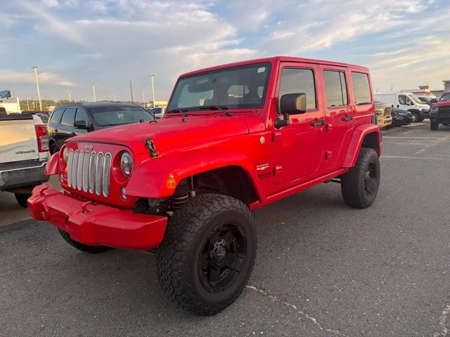 Used 2015 Red Jeep Unlimited Sahara image 3