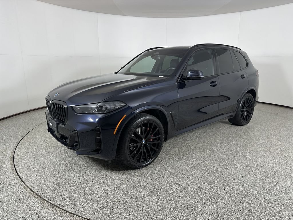 Certified Used 2024 Carbon Black Metallic BMW xDrive40i image 1