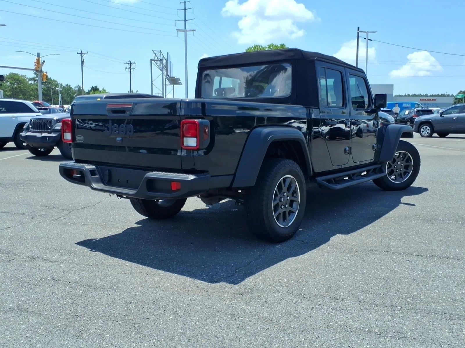 Used 2024 Black Clearcoat Jeep Sport image 2