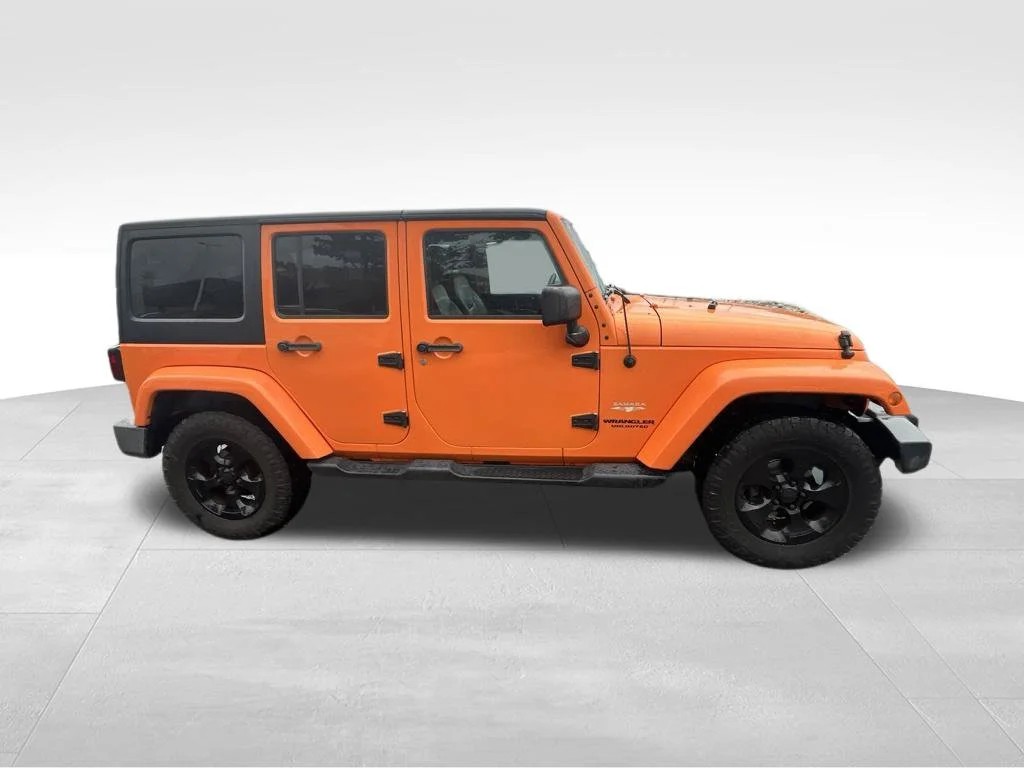 Used 2013 Orange Jeep Unlimited Sahara image 17