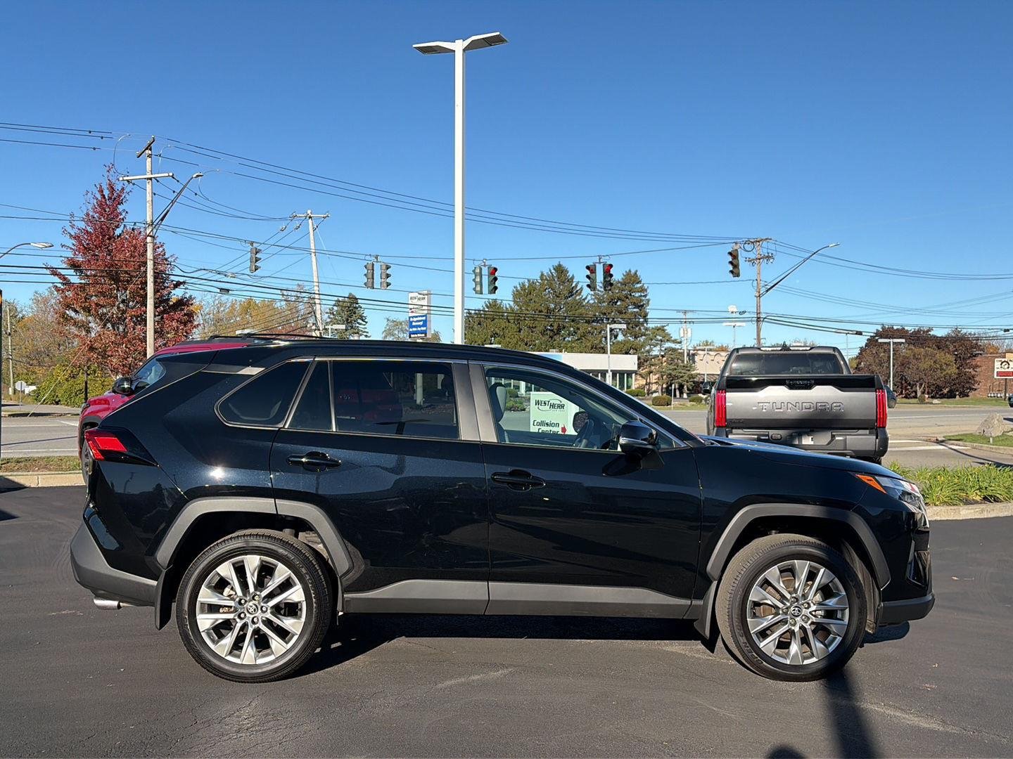 Used 2025 Midnight Black Metallic Toyota XLE Premium image 2