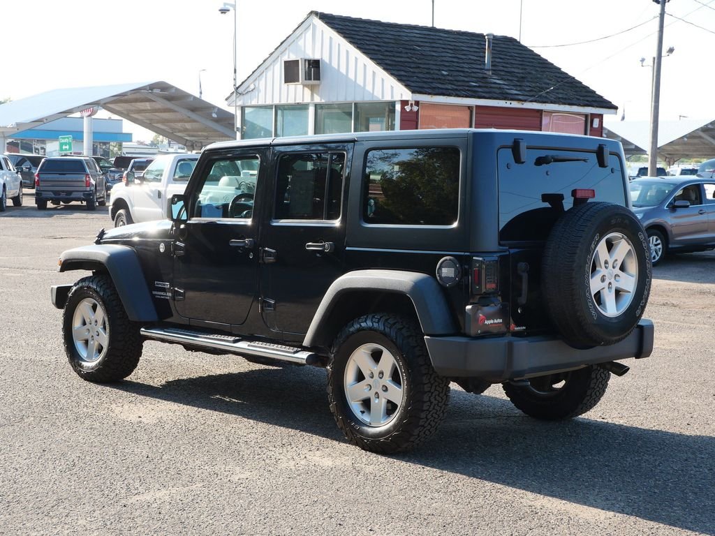 Used 2013 Black Jeep Unlimited Sport image 4