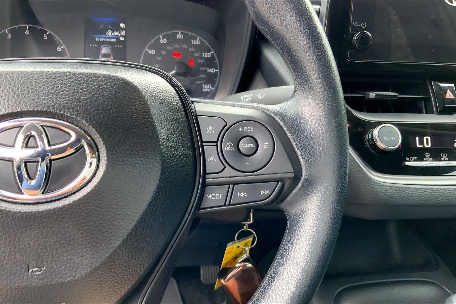 Used 2025 Midnight Black Metallic Toyota LE image 24
