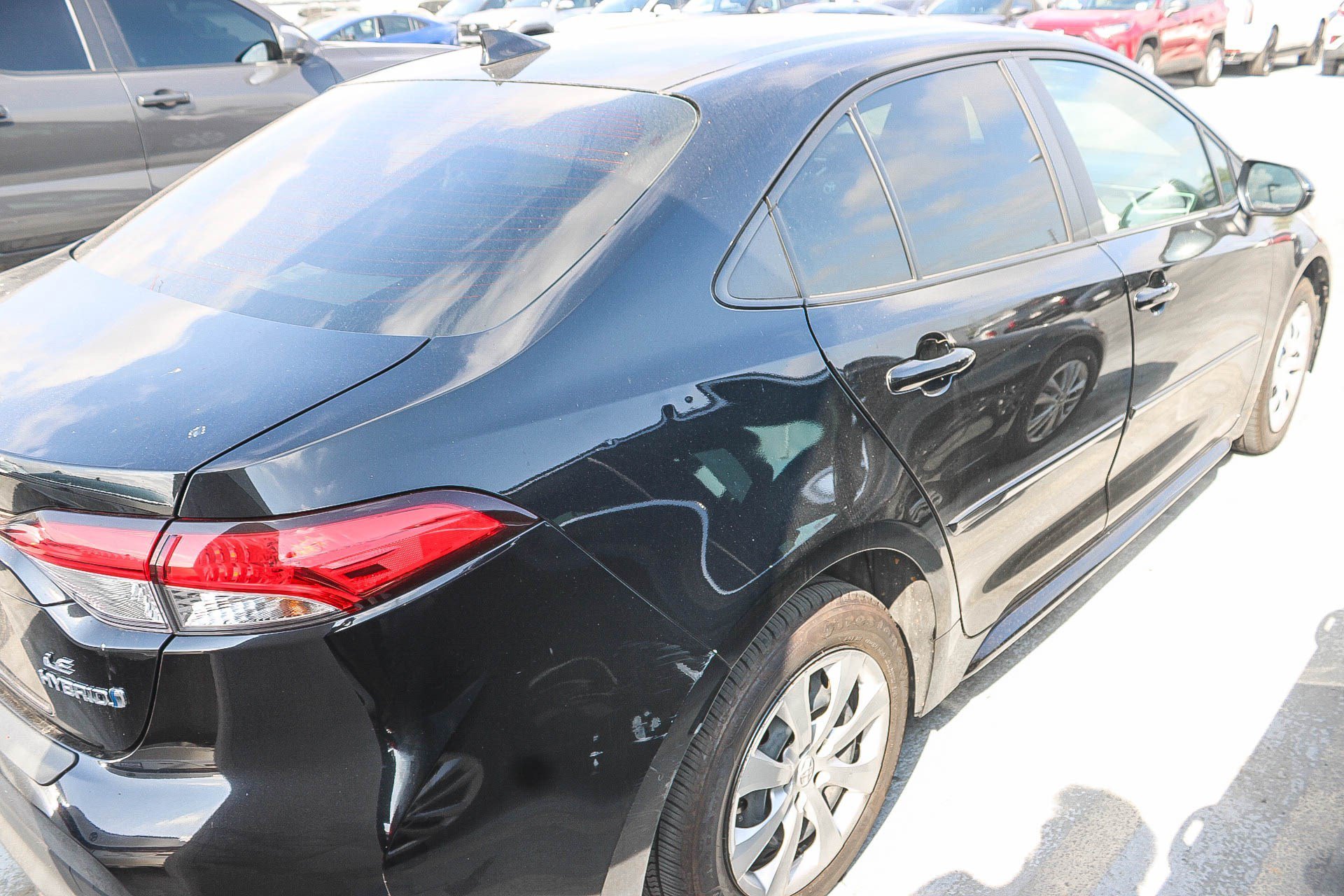 Used 2024 Midnight Black Metallic Toyota Hybrid LE image 13