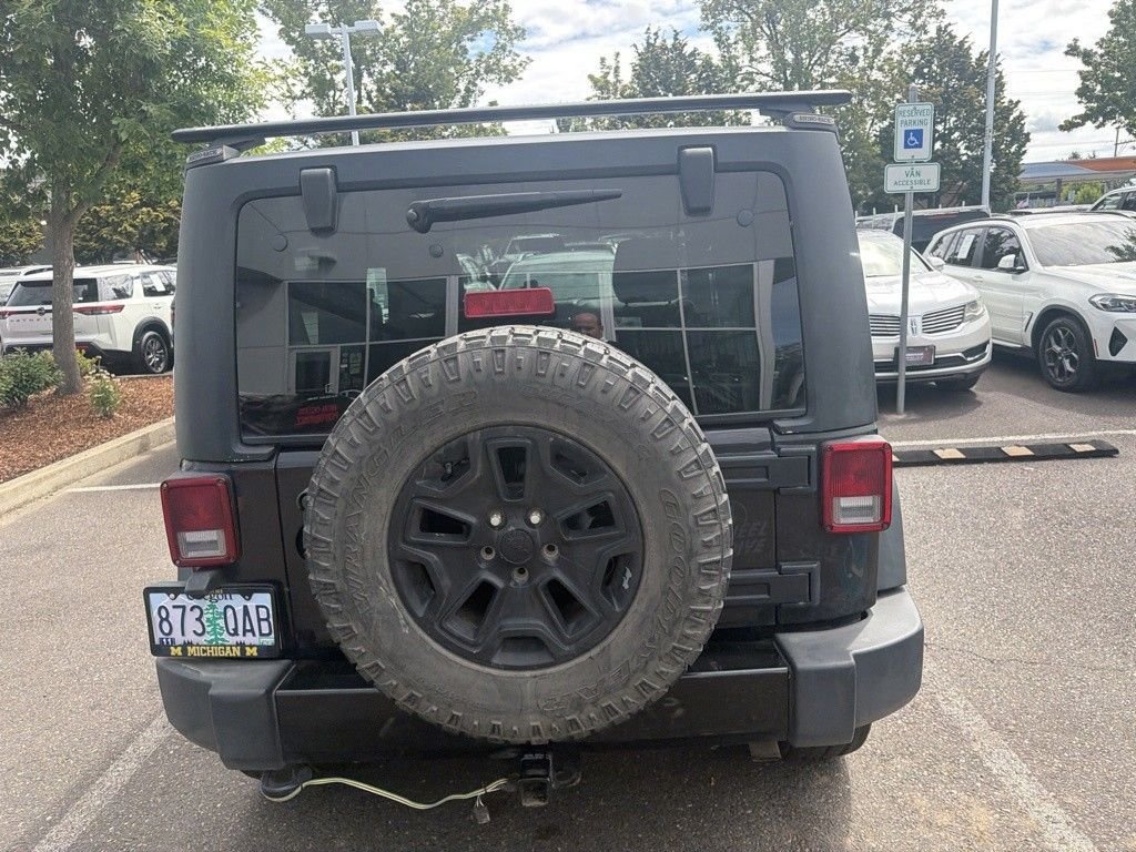 Used 2016 Black Clearcoat Jeep Sport image 4