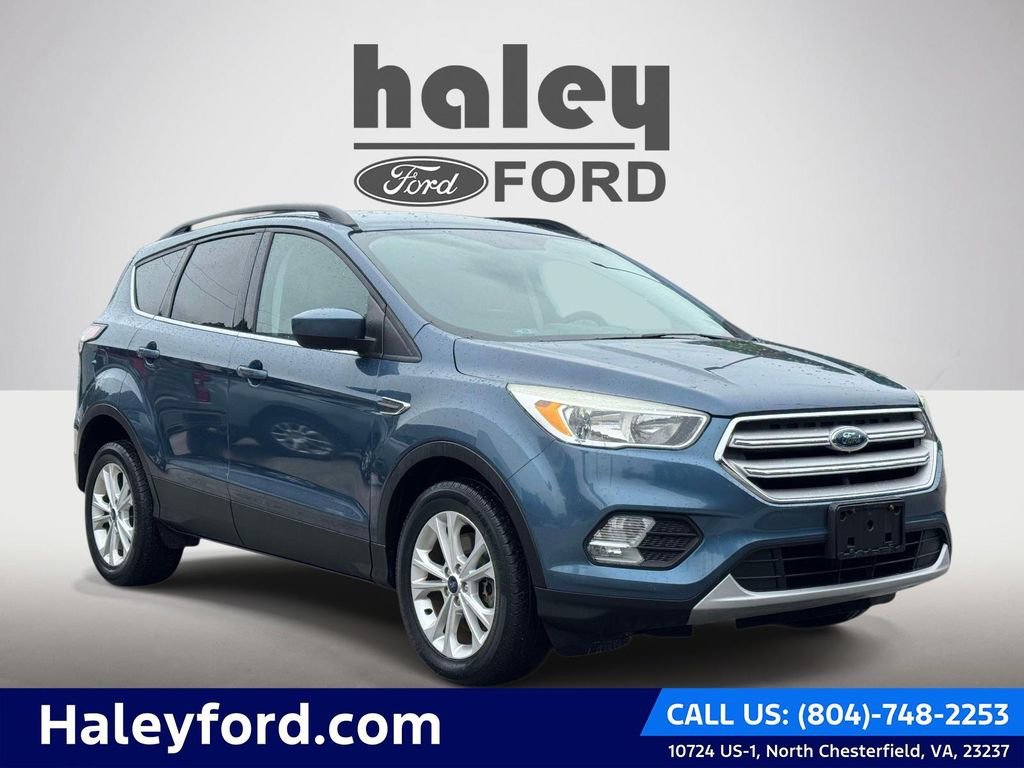 Used 2018 Blue Metallic Ford SE image 1