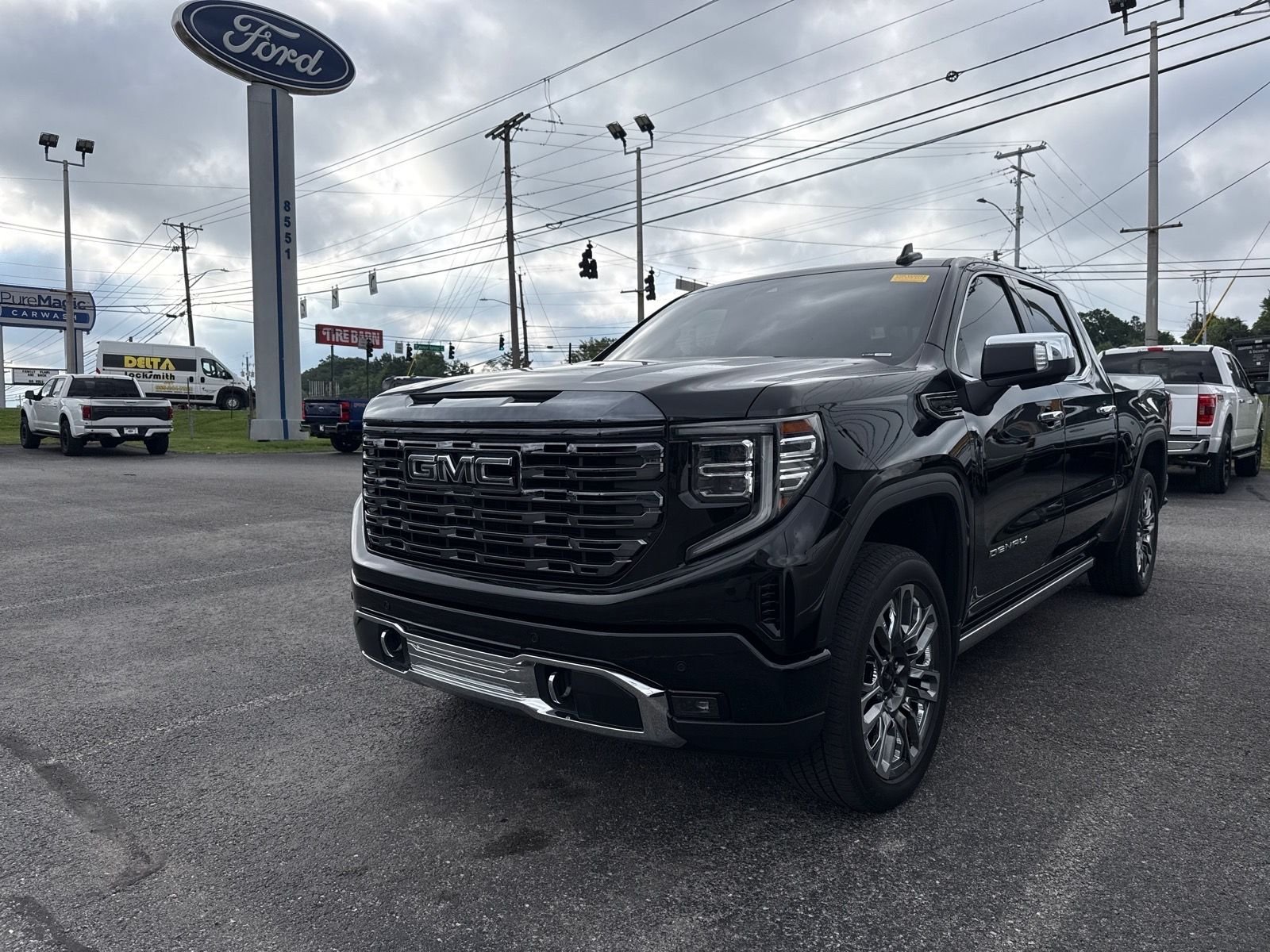 Used 2024 Black GMC Denali Ultimate image 1