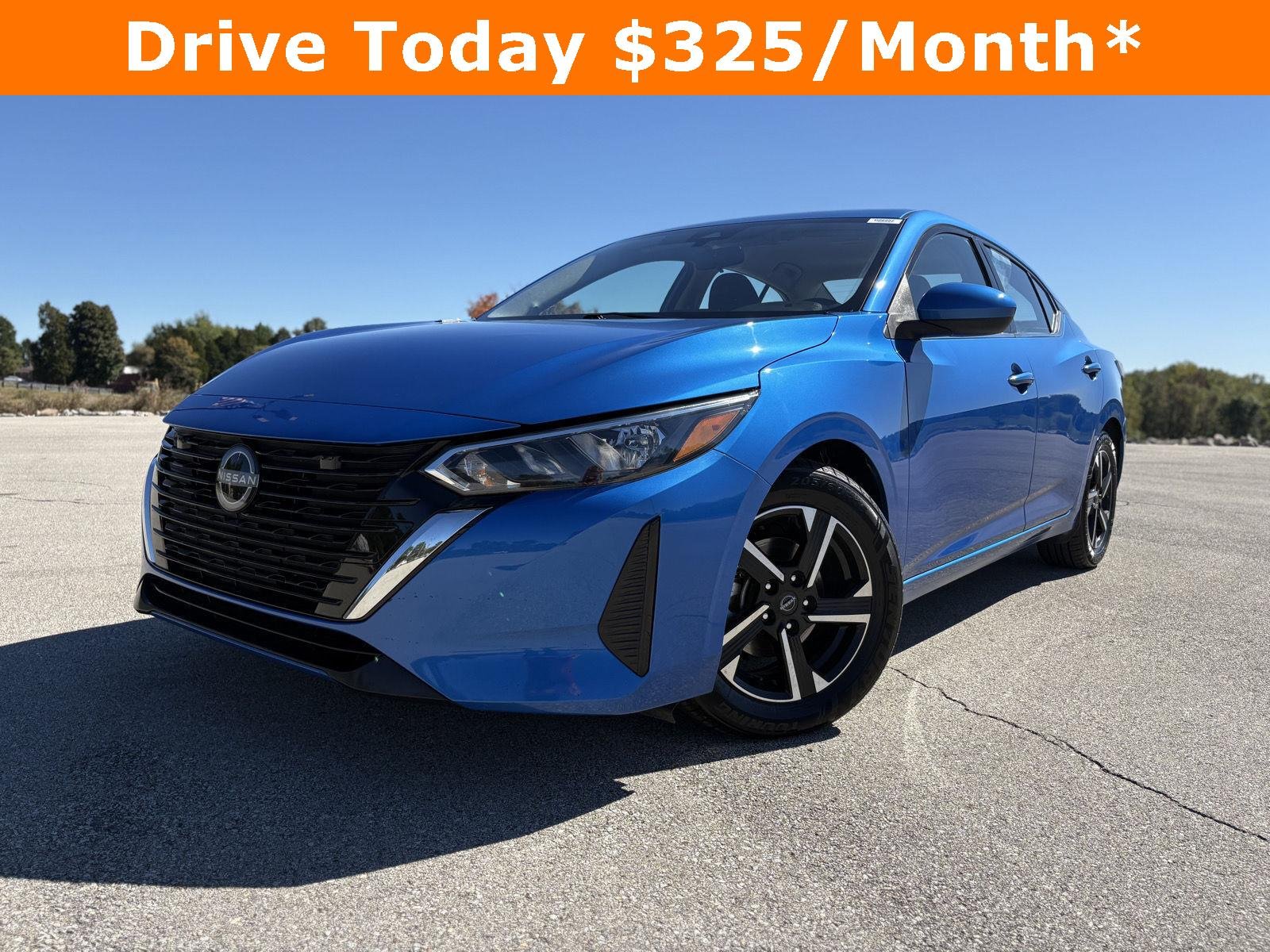 Used 2025 Electric Blue Metallic Nissan SV image 1