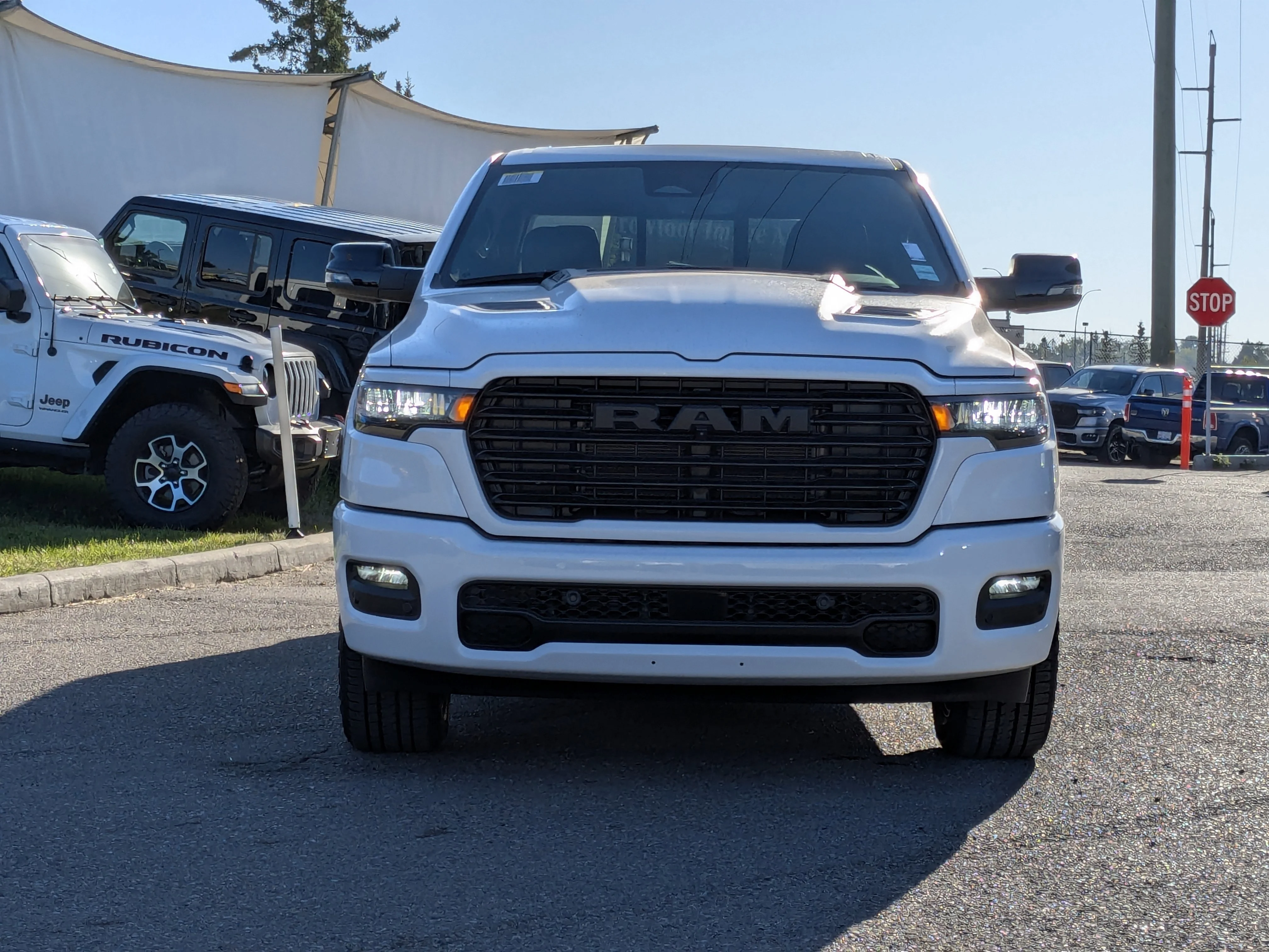 New 2026 White RAM Sport - 3.92 Rear Axle Ratio - Anti Spin Rear Diff - Sport Hood - Panoramic Sunroof & Tons More! image 2