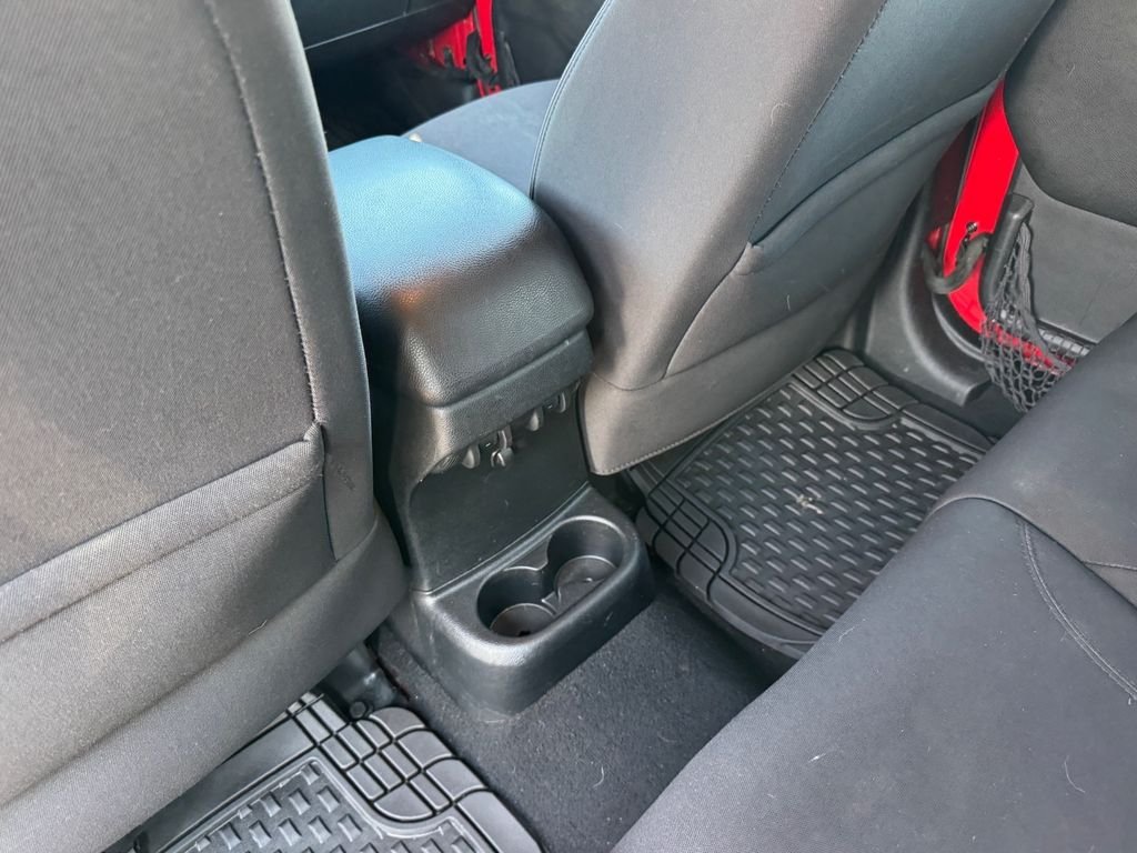 Used 2014 Red Jeep Unlimited Sport image 12