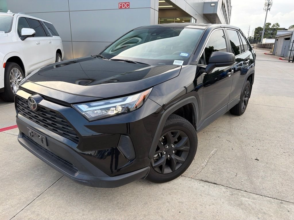 Used 2023 Midnight Black Metallic Toyota LE image 1