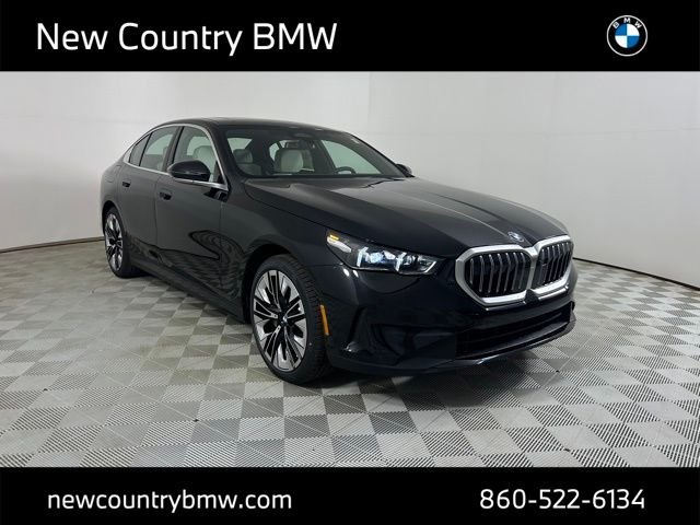 New 2027 Black Sapphire Metallic BMW 550e xDrive image 1