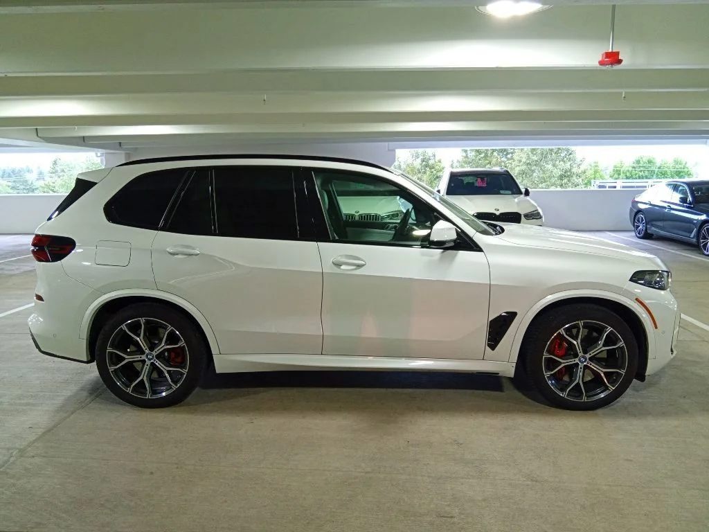 Used 2025 Mineral White Metallic BMW xDrive50e image 4