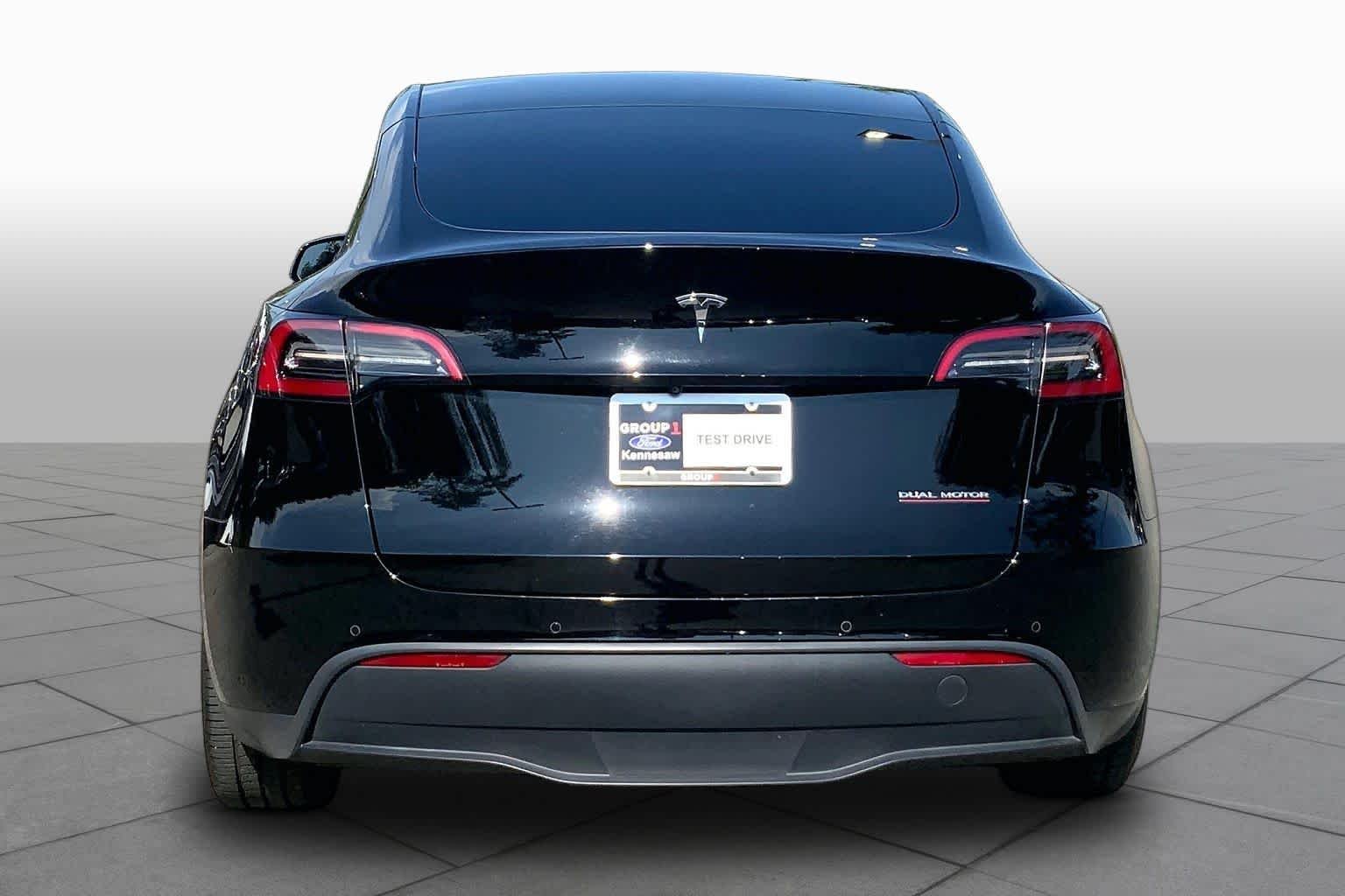 Used 2021 Solid Black Tesla Performance image 4
