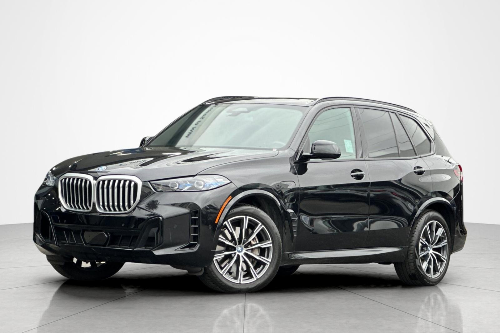 Used 2024 Black Sapphire Metallic BMW xDrive50e image 1