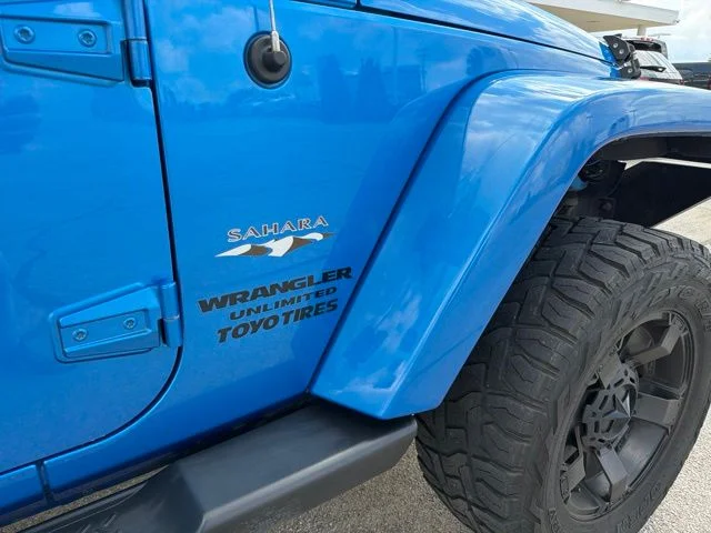 Used 2016 Blue Jeep Unlimited Sahara image 4