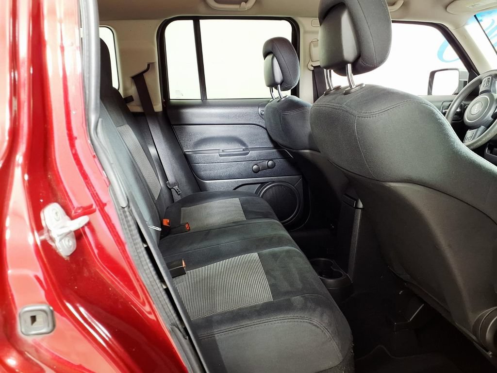 Used 2011 Deep Cherry Red Jeep Sport image 12