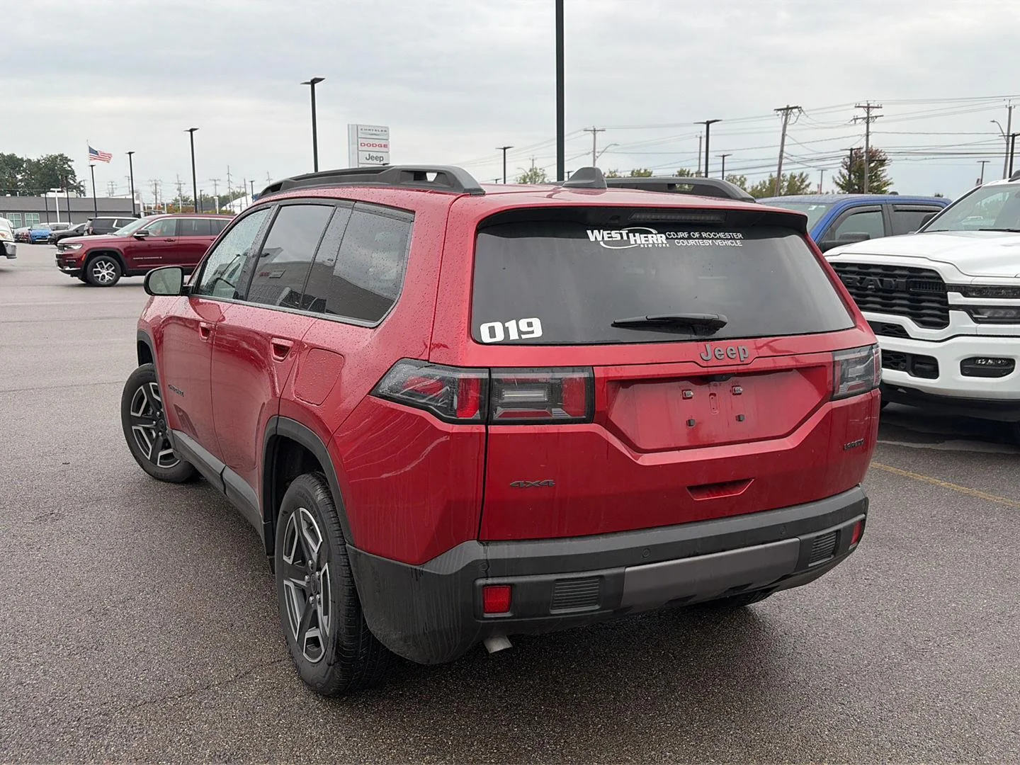 Used 2026 Red Hot Pearlcoat Jeep Laredo image 3