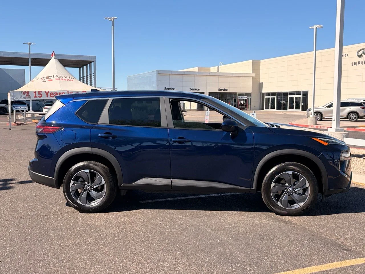 Used 2025 Deep Ocean Blue Pearl Nissan SV image 6