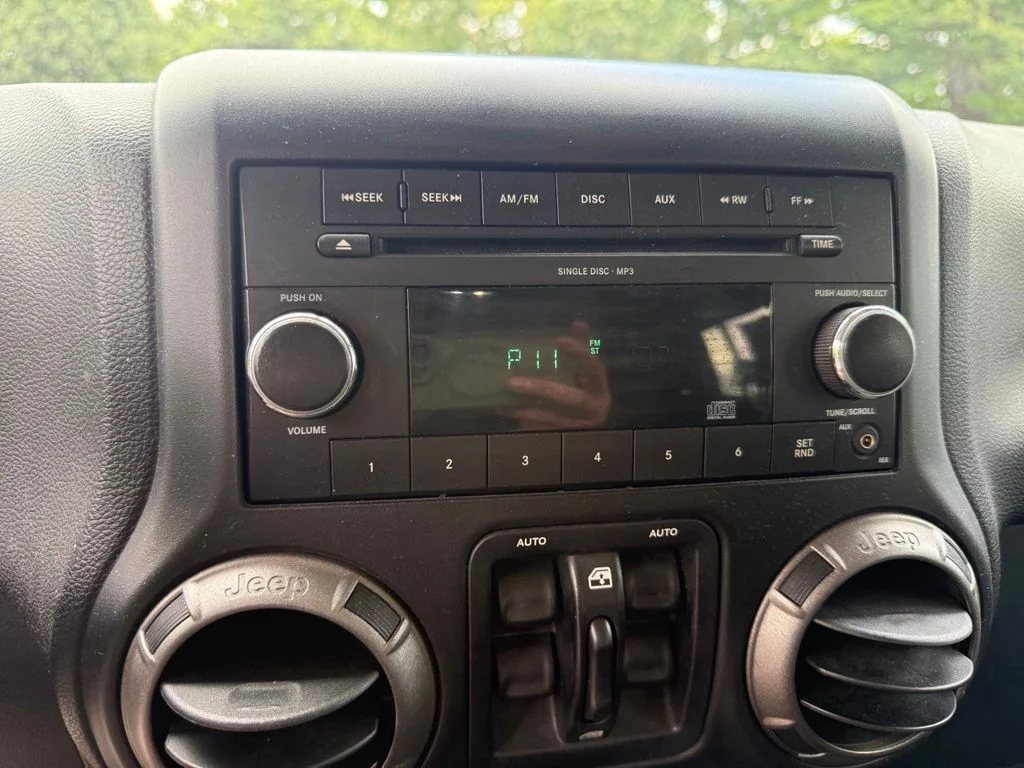 Used 2011 Black Jeep Unlimited Sport image 12