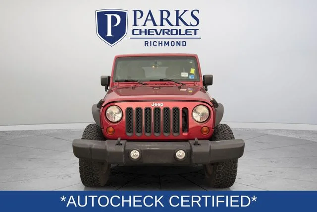 Used 2013 Red Jeep Unlimited Sahara image 2