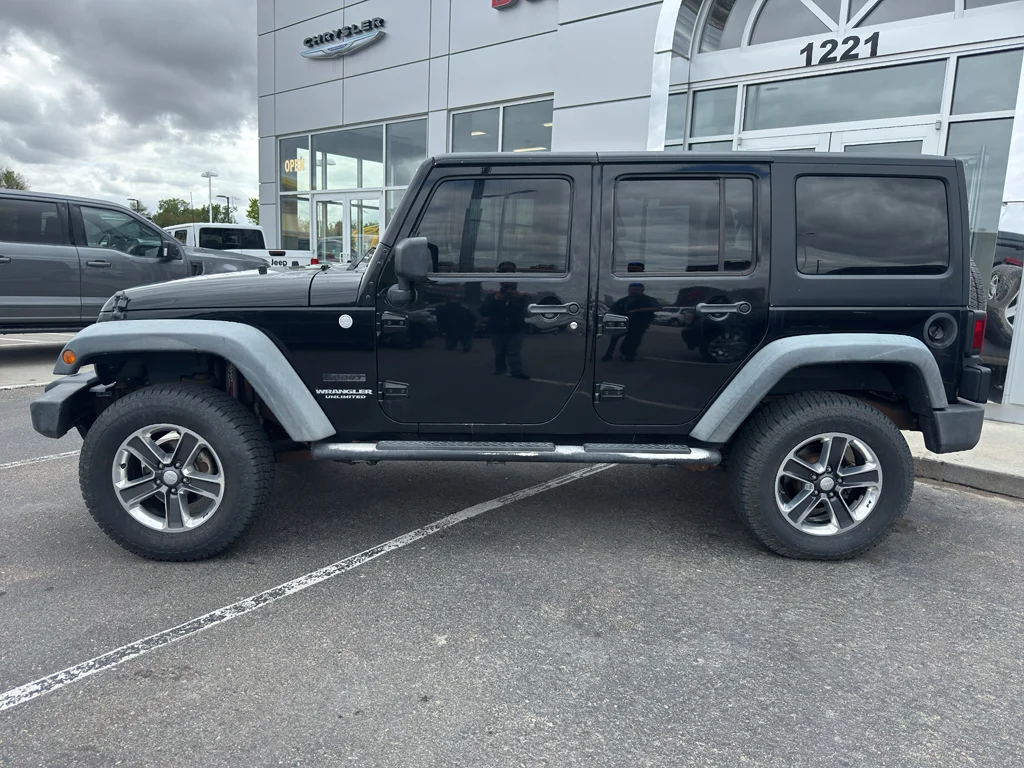 Used 2011 Black Clearcoat Jeep Sport image 2