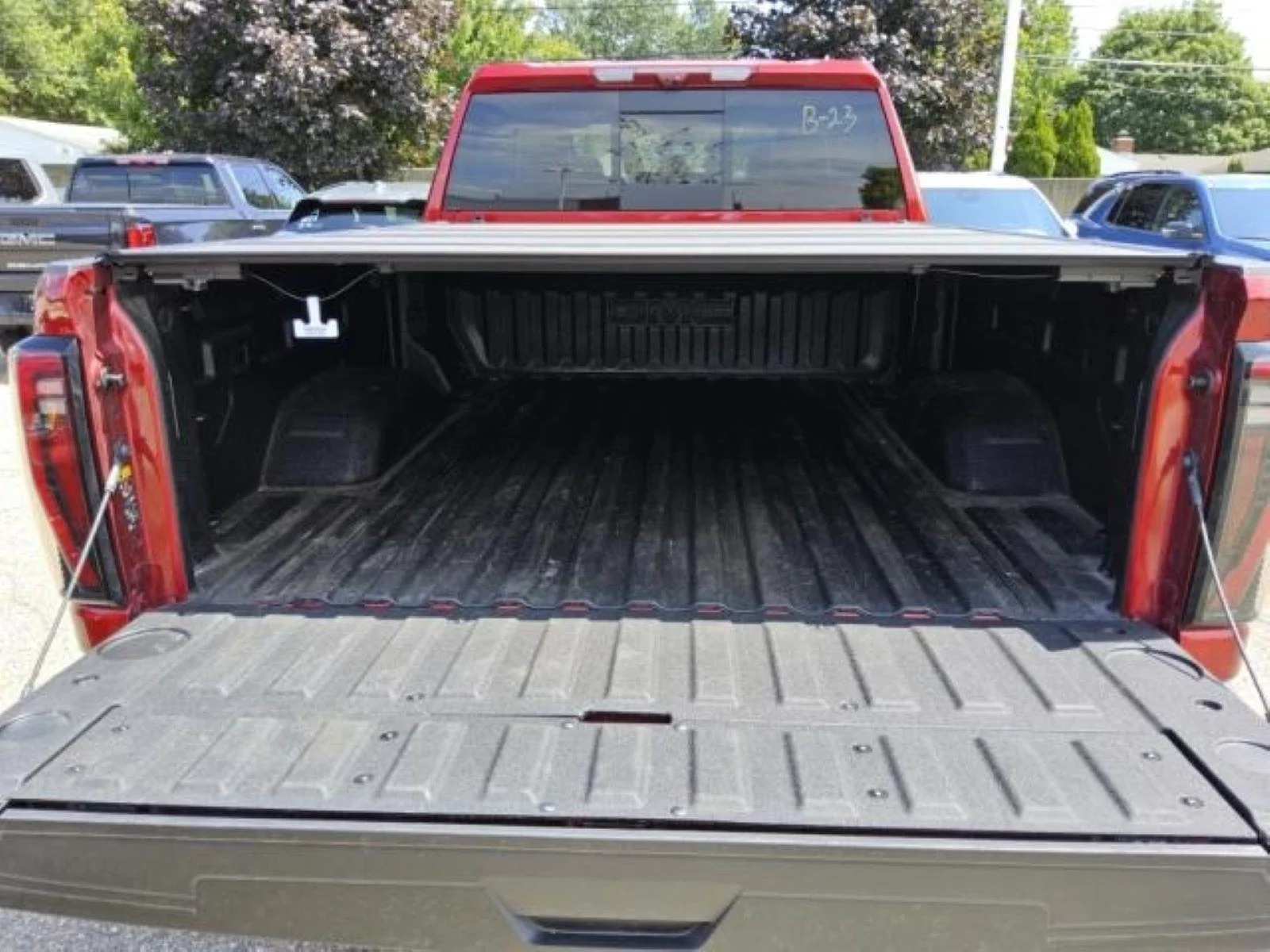 Used 2026 Volcanic Red Tintcoat GMC AT4X image 11