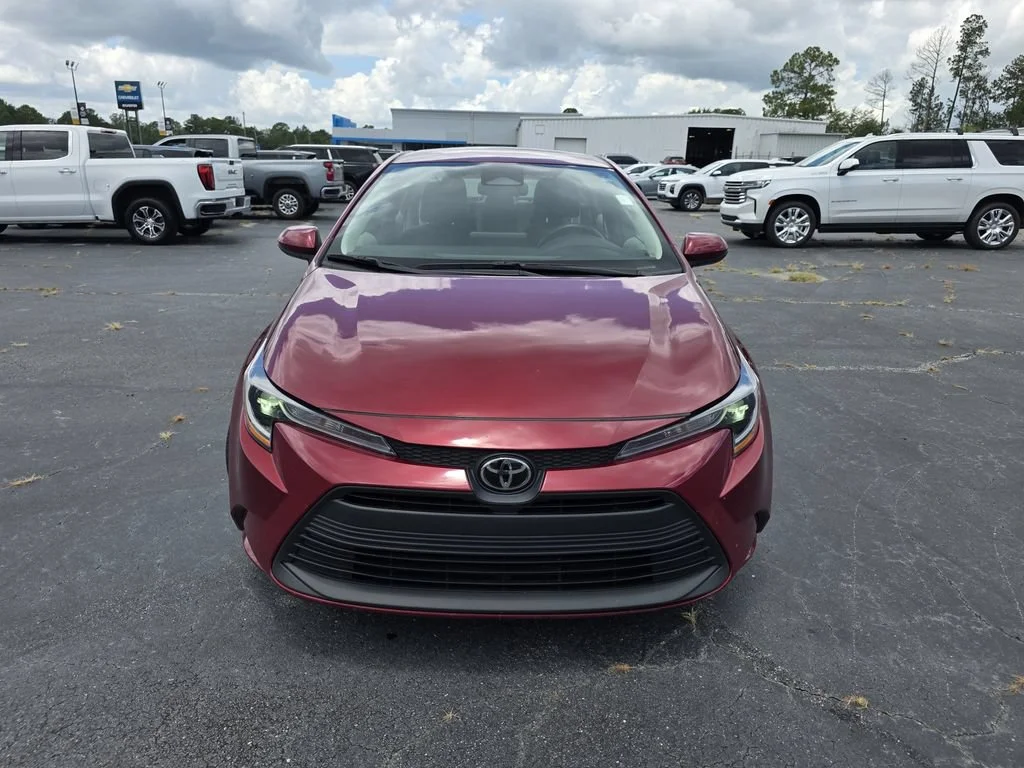 Used 2024 Red Med Toyota LE image 5